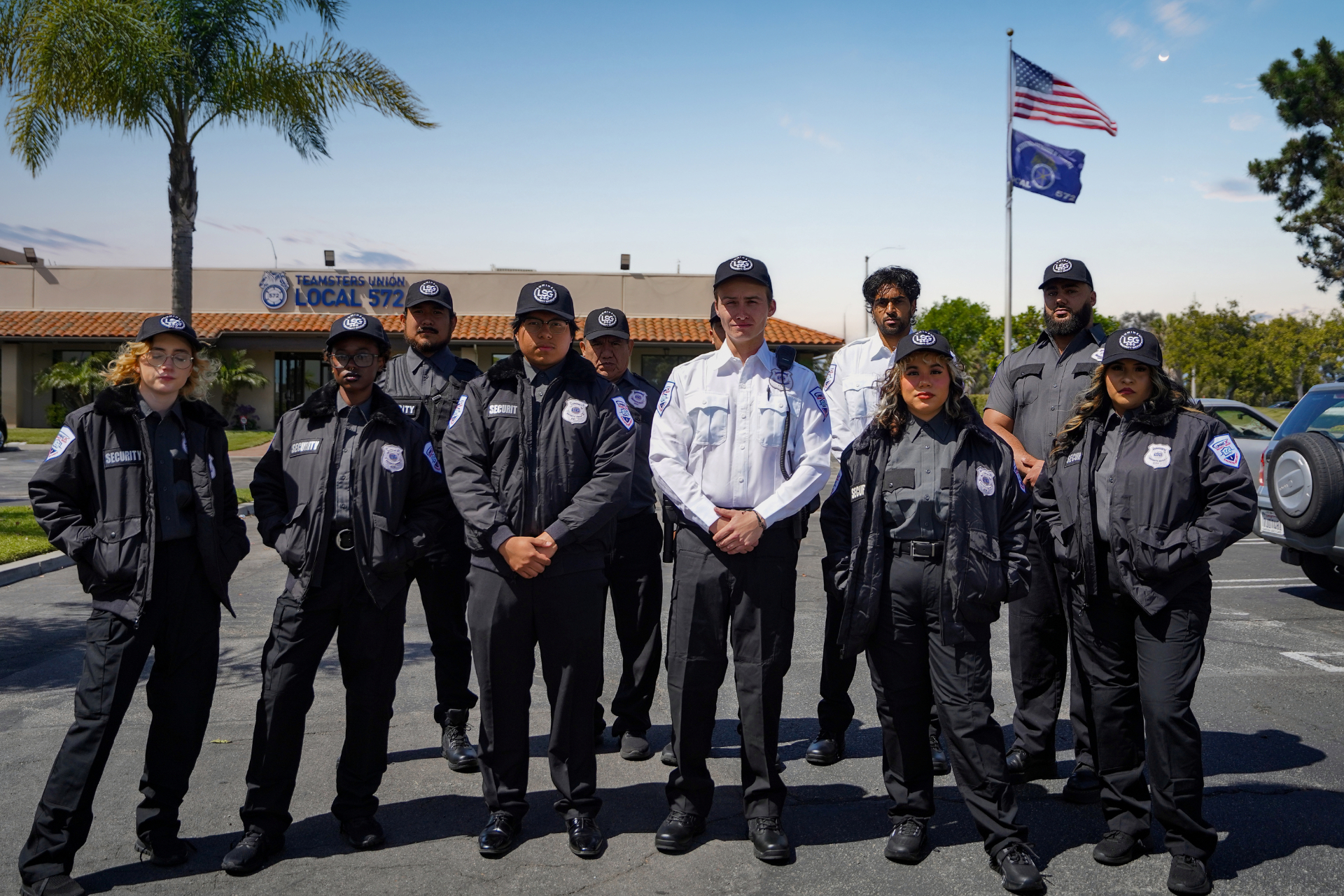 Luminex full security team in formation outside Teamsters Local 572 hall under American flag